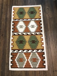 White border with earth tones rug