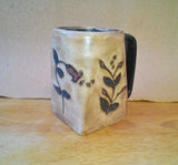 Light brown mug with flowers