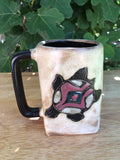 beige mug with turtle on two sides